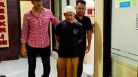Tersangka BD usai diperiksa penyidik Satreskrim Polres Bangkalan