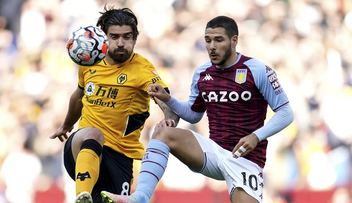 Ruben Neves. Memasuki musim kelimanya bersama Wolverhampton Wanderers usai didatangkan dari Porto pada 2017/2018, ia telah tampil dalam 185 laga dengan mencetak 21 gol dan 10 assist. Nilai pasarnya pun turun dari 45 juta euro menjadi 42 juta euro atau setara Rp.690 miliar. (PA via AP/Nick Potts)