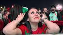 Fans cantik Portugal terlihat mengis bahagia saat timnya menang atas Wales pada semi-final Piala Eropa 2016 di Fans Zone Champ de Mars,  Paris, Kamis  (7/7/2016) dini hari WIB. (AFP/Geofroy Van Der Hasselt)