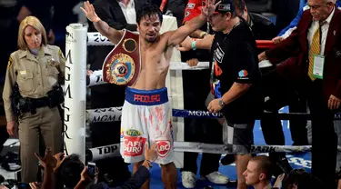 Petinju Filipina, Manny Pacquiao, sukses merebut kembali gelar juara dunia kelas Walter WBO, setelah dinyatakan menang mutlak atas rivalnya Timothy Bradley, Sabtu waktu setempat atau Minggu (13/4/2014). (REUTERS/Joe Camporeale-USA TODAY)