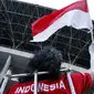 Seorang suporter Timnas Indonesia sebelum memasuki Stadion Utama Gelora Bung Karno pada laga kualifikasi Piala Dunia 2014 antara Indonesia dan Turkmenistan di Jakarta, Kamis 28 Juli 2011. FOTO ANTARA/Sigid Kurniawan