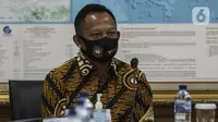 Menteri Dalam Negeri Tito Karnavian saat mengunjungi Kantor KPU, Jakarta, Kamis (30/7/2020). Kunjungan Tito Karnavian dalam rangka membahas pelaksanaan Pemilihan Serentak 2020. (Liputan6.com/Johan Tallo)