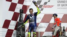 Pembalap Movistar Yamaha Valentino Rossi finis di posisi ketiga dalam balapan MotoGP Qatar di Sirkuit Losail, Minggu (18/3/2018) malam WIB. (KARIM JAAFAR / AFP)