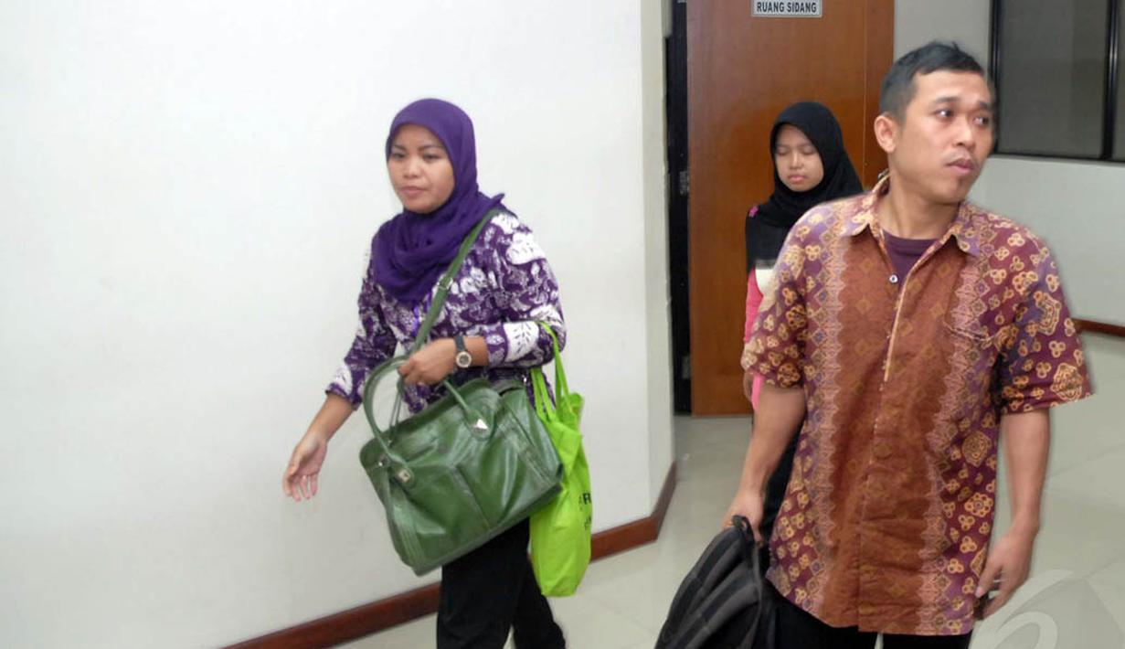 Hendra Saputra saat memasuki ruang persidangan di Pengadilan Tindak Pidana Korupsi  (Tipikor) , Jakarta (23/7/14) (Liputan6.com/Miftahul Hayat)