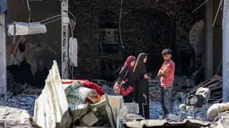 Dalam laporan tersebut disebutkan 12 di antaranya merupakan warga pencari bantuan. (Omar AL-QATTAA/AFP)