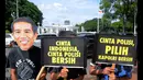 Peserta melakukan aksi teatrikal sambil membawa tulisan menolak pencalona Budi Gunawan di depan Istana Negara, Jakarta, Rabu (21/1/2015). Aksi dilakukan untuk menolak pencalonan Komjen Budi Gunawan (BG) menjadi Kapolri. (Liputan6.com/Faisal R Sya