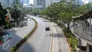 Penampakan jalan protokol yang lengang di kawasan Kuningan, Jakarta, Kamis (16/7/2015). H-1 jelang Lebaran, situasi Ibukota Jakarta sudah sepi ditinggal warganya yang mudik ke kampung halaman. (Liputan6.com/Faizal Fanani)