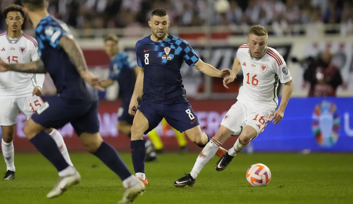 Hasil imbang  membuat Wales dan Kroasia berturut-turut duduk di peringkat dua dan tiga klasemen Grup D. (AP Photo/Darko Bandic)