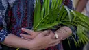 Minggu Palma memiliki makna memiliki yang mendalam bagi umat Katolik dalam memperingati masuknya Yesus ke Yerusalem. (JUNI KRISWANTO/AFP)
