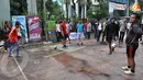 Sejumlah tim peserta melakukan pemanasan menjelang dimulainya 3 on 3 Futsal Challenge Road to BPL di Universitas Sahid, Jakarta. (Liputan6.com/Abdul Aziz Prastowo)