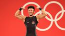 Rahmat Erwin Abdullah yang baru berusia 20 tahun merupakan anak kandung dari mantan lifter nasional, Erwin Abdullah, yang kini juga berstatus sebagai pelatih yang menanganinya menjelang berlomba di Olimpiade Tokyo 2020. (Foto: NOC Indonesia)