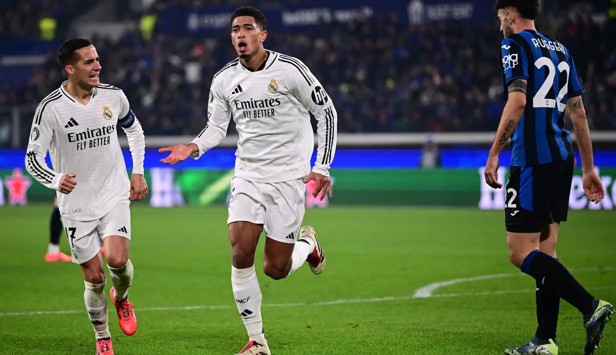 Tiga menit berselang atau pada menit ke-59, gol Jude Bellingham berhasil memperlebar jarak keunggulan Real Madrid atas Atalanta. (Marco BERTORELLO/AFP)