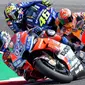 Pebalap Andrea Dovizioso, Marc Marquez dan Valentino Rossi saat sesi kualifikasi MotoGP San Marino di Sirkuit Marco Simoncelli, Minggu (9/9/2018). Lorenzo menjadi yang tercepat dengan catatan waktu 1 menit 31,629 detik. (AFP/Tiziana Fabi)