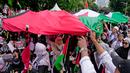 Aksi Protes Global dilakukan di 100 kota dunia untuk menuntut penghentian genosida di Gaza, Palestina. (AP Photo/Dita Alangkara)