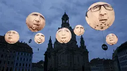 Balon yang menggambarkan wajah pemimpin negara anggota G7 menghiasi kota Dresden, Jerman, (27/5/2015). Kanselir Jerman Angela Merkel mengatakan, tak terbayangkan bila Rusia berpartisipasi dalam pertemuan G7. (REUTERS/Fabrizio Bensch)