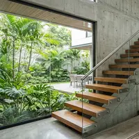 Rumah modern dengan desain tangga mengambang. [AI Generated]