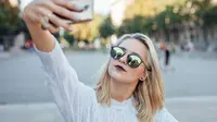 Ilustrasi selfie (iStockphoto)