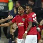 Striker Manchester United (MU)  Anthony Martial (tengah) bersama Juan Mata dan Marcus Rashford merayakan gol ke gawang Partizan pada matchday keempat Grup L Liga Europa di Old Trafford, Jumat (8/11/2019) dini hari WIB.(AP Photo/Dave Thompson)