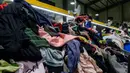 Hasil penelitian Ellen MacArthur Foundation menyebut bahwa emisi karbon yang dihasilkan industri fesyen lebih banyak dibandingkan dengan gabungan emisi karbon dari penerbangan dan pelayaran internasional. (ANTHONY WALLACE/AFP)