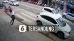 Terekam kamera CCTV seorang perempuan tersandung dan jatuh di zebra cross tengah jalan.