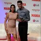 Cristiano Ronaldo bersama kekasihnya Georgina Rodriguez berpose setelah meraih penghargaan MARCA Legend award di Reina Victoria Theater, Madrid (30/7/2019). Di acara tersebut Ronaldo mengaku berharap dapat kembali ke Real Madrid. (AFP Photo/Javier Soriano)