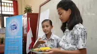 Pada Jumat, 7 Desember 2018, Diadakan Lomba Pelangi di Piring Makanku yang Diikuti Murid Kelas IV dan V SD Inpres 109 Sorong, Papua Barat (Foto: Aditya Eka Prawira/Liputan6.com)