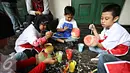 Penyandang disabilitas down sindrom, autis, dan asperger melukis keramik di Museum Seni Rupa dan Keramik, Jakarta, Jumat (23/10). Kegiatan untuk meningkatkan kemampuan dan keterampilan seni bagi penyandang disabilitas . (Liputan6.com/Immanuel Antonius)