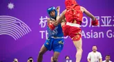 Cabang wushu kembali menambah perbendaharaan medali Kontingen Indonesia pada ajang Asian Games 2022, Kamis (28/9/2023). Adalah Samuel Marbun yang berlaga di nomor sanda kelas 65kg putra yang memastikan merebut medali perak setelah kalah dari atlet asal Iran, Afsin Shalimi Toupghara dalam laga final yang digelar di Xiaoshan Guali Sports Centre, Hangzhou, China. Hasil ini tergolong luar biasa bagi atlet asal Sumatera Utara tersebut yang menjalani debutnya di Asian Games Hangzhou 2022. (NOC Indonesia/Naif Al'as)