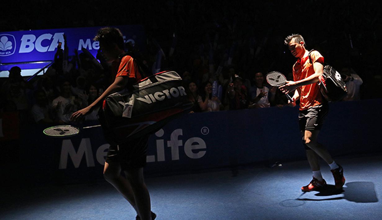 Tontowi Ahmad/Liliyana Natsir memasuki arena pertandingan BCA Indonesia Open 2015. (Peksi Cahyo/Bola.com)