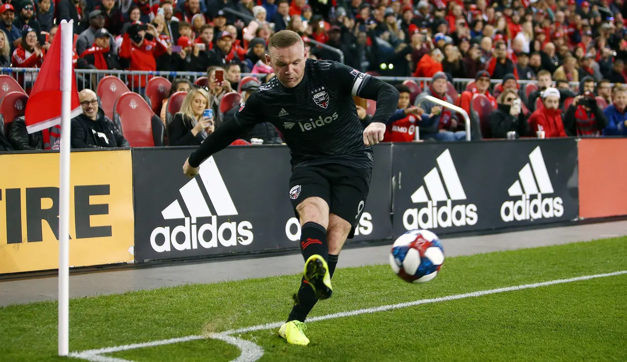 DC United bukanlah klub yang asing bagi Wayne Rooney, sebab ia pernah bergabung bersamanya sebagai pemain di tahun 2018 dan 2019. Bersama DC United, ia total tampil dalam 52 laga dengan torehan 25 gol dan 14 assist. (AFP/Getty Images/Vaughn Ridley)