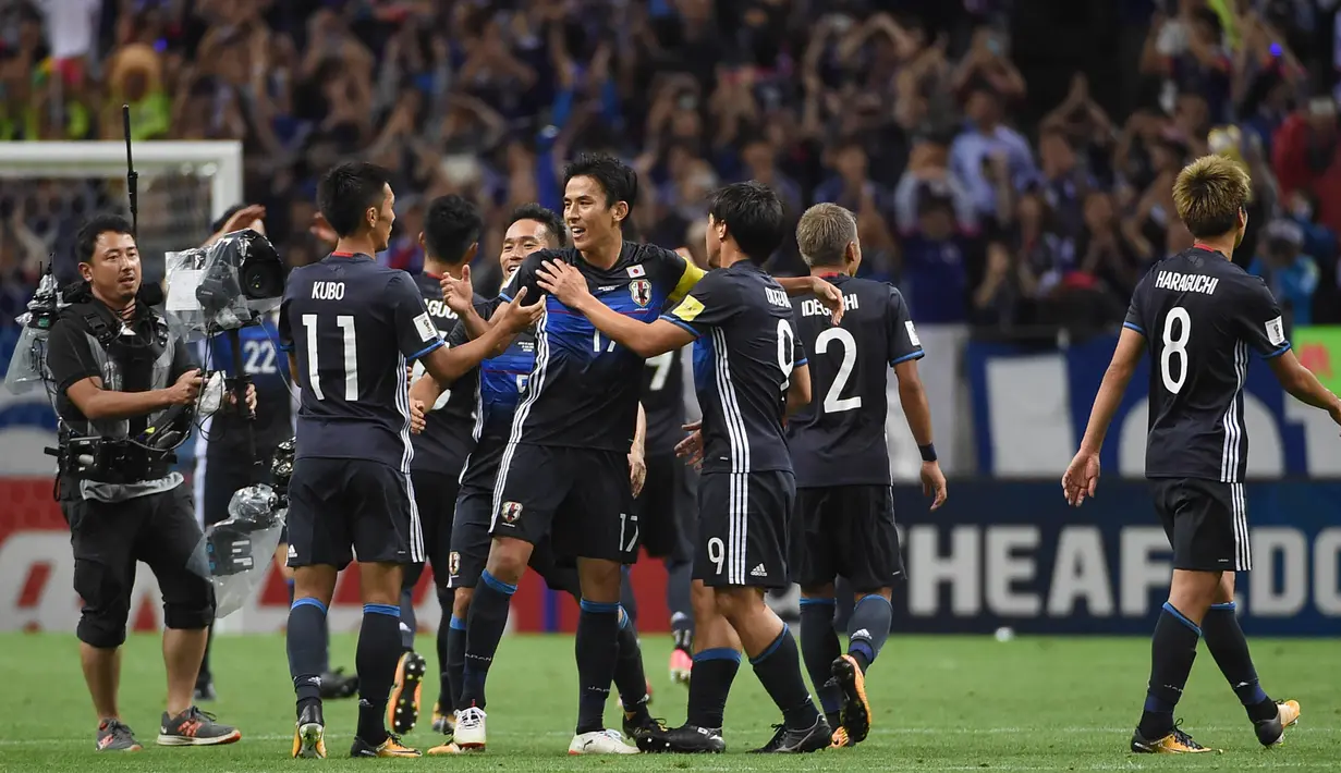 2. Jepang - Meski kalah pada laga terakhir melawan Arab Saudi, negeri samurai tetap menjadi juara Grup B pada babak kualifikasi dan lolos ke Piala Dunia. Sejak 1998, Jepang tidak pernah absen dari gelaran bergengsi World Cup. (AFP/Toru Yamanaka)