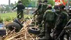 Penyerangan yang dilakukan tentara Thailand ke perkemahan Kaus Merah di pusat Bangkok menyebabkan dua korban tewas.