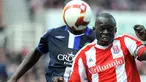 Stoke City's Senegalese midfielder Abdoulaye Diagne-Faye clears from Blackburn Rovers' Congolese defender Christopher Samba during the EPL football match at the Britannia Stadium on April 18, 2009. AFP PHOTO/ANDREW YATES