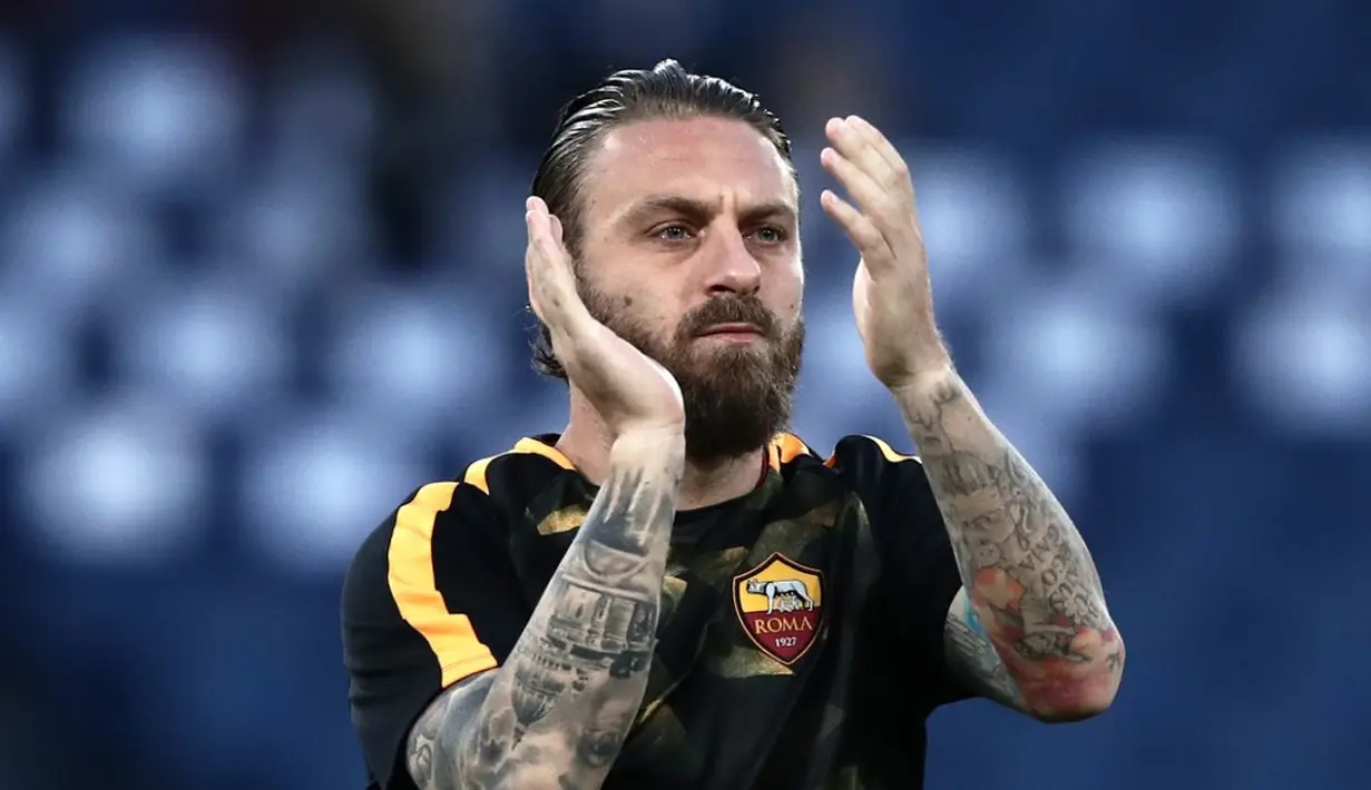 De Rossi memang terkenal dengan gaya bermain yang keras dan tanpa kompromi. Dengan brewok membuat penampilannya semakin di takuti oleh lawan. (AFP/Isabella Bonotto)