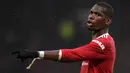 Paul Pogba. Gelandang Manchester United berusia 28 tahun yang telah 6 musim memperkuat Setan Merah sejak 2016/2017 ini kontraknya akan berakhir akhir musim ini. Jika tidak ada kontrak baru, Juventus sebagai klub sebelumnya tertarik untuk memboyongnya kembali. (AFP/Oli Scarff)