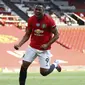 Penyerang Manchester United, Anthony Martial, melakukan selebrasi usai membobol gawang Sheffield United pada laga Premier League di Stadion Old Trafford, Rabu (24/6/2020). Manchester United menang dengan skor 3-0. (AP/Michael Steele)