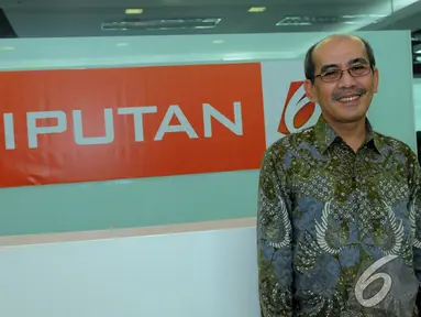 Ketua Tim Reformasi Tata Kelola Minyak dan Gas Bumi Faisal Basri saat mengunjungi kantor Liputan6.com, Jakarta, Selasa (6/1/2015). (Liputan6.com/Faisal R Syam)