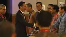 Presiden Joko Widodo saat tiba menghadiri sarasehan 100 ekonom Indonesia di Jakarta, Senin (12/12). (Liputan6.com/Angga Yuniar)