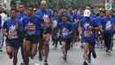 Peserta Water Run mengikuti lomba lari saat puncak peringatan Hari Air Sedunia tahun 2019 di area car free day kawasan Sudirman, Jakarta, Minggu (24/3). Momentum peringatan Hari Air Sedunia tersebut bertujuan mengkampanyekan “air untuk semua”. (merdeka.com/Arie Basuki)