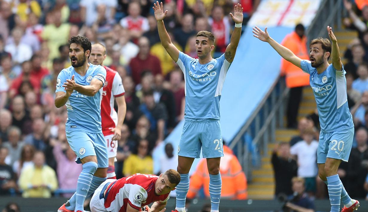 Di Grup E, tiga pemain Manchester City, Rodri dan Ferran Torres (Spanyol) akan menghadapi Ilkay Gundogan (Jerman) di matchday kedua Grup E, 28 November 2022. (AFP/Oli Scarff)