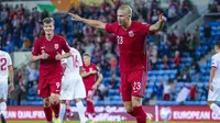 Striker muda Norwegia, Erling Haaland, melakukan selebrasi setelah mencetak gol ke gawang Gibraltar, Rabu (8/9/2021) dini hari WIB. Norwegia berhasil menang telak 5-1 dalam pertandingan tersebut. (Håkon Mosvold Larsen / NTB / AFP)