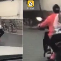 Seorang gadis belajar di atas motor yang belajar. (Sumber Foto: NextShark)