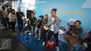 Grup musik Nidji tampil menghibur penumpang di Halte Transjakarta Sarinah, Thamrin, Jakarta Pusat, Senin (27/3). Acara tersebut diadakan dalam rangka memperingati ulang tahun ke-3 PT Transjakarta. (Liputan6.com/Immanuel Antonius)