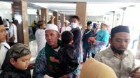 Kedatangan Jamaah Haji Banyuwangi Disambut Haru Keluarganya (Hermawan Arifianto/Liputan6.com)