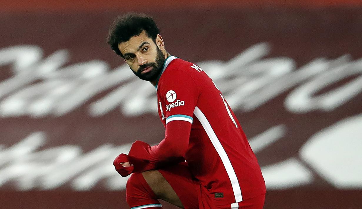 1. Mohamed Salah (Liverpool) - Posisi pemain asal Mesir ini belum tergoyahkan dari urutan puncak daftar top skor sementara Liga Inggris 2020/2021. Mohamed Salah sendiri telah mencetak 13 gol dari 17 laga Liverpool musim ini. (AFP/Clive Brunskill/pool)