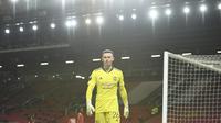Dean Henderson masih kesulitan mendapatkan tempat di bawah mistar gawang Manchester United, menggantikan peran David De Gea. Namun, Ia terus tampilkan performa apiknya dengan mencatat presentase penyelamatannya sebesar 76 persen pada musim lalu. (Foto: AFP/Oli Scarff)