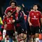 Pemain Manchester United, Bruno Fernandes (kedua kiri) bersama Joshua Zirkzee (tengah) dan Rasmus Hojlund (kedua kanan) melakukan selebrasi usai pertandingan sepak bola Liga Premier Inggris melawan Manchester City di Stadion Etihad, Manchester, Inggris, pada 15 Desember 2024. (Paul ELLIS/AFP)