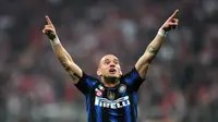 Wesley Sneijder memperlihatkan penampilan terbaiknya saat Inter ditukangi Mourinho. Bersama Samuel Eto'o dan Diego Milito, Sneijder memiliki peran penting atas sukses Inter meraih treble winners musim 2009-2010. (AFP/Christof Stache)