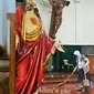 Sosok Wanita Berhijab yang Sapu Gereja Santa Lidwina (Candra Malik/twitter.com)