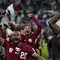 Pemain Qatar, Almoez Ali dan rekan-rekannya merayakan kemenangan atas Iran pada laga semifinal Piala Asia 2023 di Al Thumama Stadium, Doha, Qatar, Rabu (07/02/2024). (AP Photo/Thanassis Stavrakis)